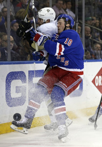 Apr 21, 2016; New York, NY, USA; New York Rangers center J.T. Miller (10) checks Pittsburgh Penguins defenseman Ian Cole (28) during the second period in game four of the first round of the 2016 Stanley Cup Playoffs at Madison Square Garden. Mandatory Credit: Adam Hunger-USA TODAY Sports