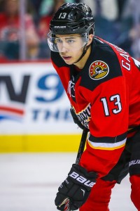 Apr 7, 2016; Calgary, Alberta, CAN; Calgary Flames left wing Johnny Gaudreau (13) during the face off against the Vancouver Canucks during the second period at Scotiabank Saddledome. Calgary Flames won 7-3. Mandatory Credit: Sergei Belski-USA TODAY Sports