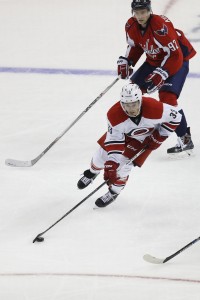 Sep 21, 2015; Washington, DC, USA; Carolina Hurricanes forward Derek Ryan (33) skates with the puck past Washington Capitals center Evgeny Kuznetsov (92) in the second period at Verizon Center. The Capitals won 2-0. Mandatory Credit: Geoff Burke-USA TODAY Sports