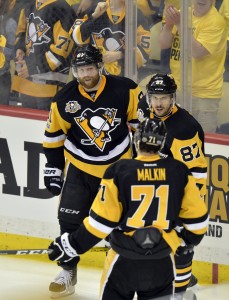 May 21, 2017; Pittsburgh, PA, USA; Pittsburgh Penguins right wing Phil Kessel (81) Sidney Crosby (87) and Evgeni Malkin (71) celebrate after Kessel scores during the third period against the Ottawa Senators in game five of the Eastern Conference Final of the 2017 Stanley Cup Playoffs at PPG PAINTS Arena. Mandatory Credit: Don Wright-USA TODAY Sports