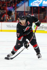 Nov 20, 2016; Raleigh, NC, USA; Carolina Hurricanes defensemen Justin Faulk (27) takes a slap shot against the Winnipeg Jets during the second period at PNC Arena. The Carolina Hurricanes defeated the Winnipeg Jets 3-1. Mandatory Credit: James Guillory-USA TODAY Sports