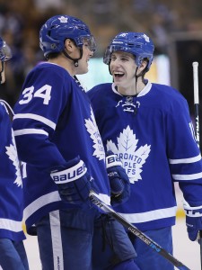 Nov 5, 2016; Toronto, Ontario, CAN; Toronto Maple Leafs forward Auston Matthews (34) and forward Mitchell Marner (16) celebrate a win over the Vancouver Canucks at Air Canada Centre. Toronto defeated Vancouver 6-3. Mandatory Credit: John E. Sokolowski-USA TODAY Sports