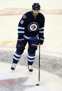 Nov 29, 2016; Winnipeg, Manitoba, CAN; Winnipeg Jets center Bryan Little (18) makes his first appearance after a lengthy injury prior to the game between the New Jersey Devils and the Winnipeg Jets at MTS Centre. Mandatory Credit: Bruce Fedyck-USA TODAY Sports