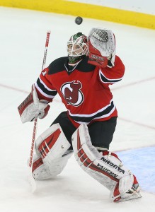 Mar 25, 2016; Newark, NJ, USA; New Jersey Devils goalie Scott Wedgewood (31) watches the puck sail over his head during the third period at Prudential Center. The Capitals defeated the Devils 1-0 in overtime. Mandatory Credit: Ed Mulholland-USA TODAY Sports