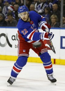 Dec 23, 2017; New York, NY, USA; New York Rangers defenseman Kevin Shattenkirk (22) clears the puck against the Toronto Maple Leafs during the first period at Madison Square Garden. Mandatory Credit: Adam Hunger-USA TODAY Sports