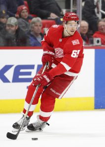 Detroit Red Wings defenseman Danny DeKeyser (65) skates with the puck during the first period against the Montreal Canadiens at Little Caesars Arena.