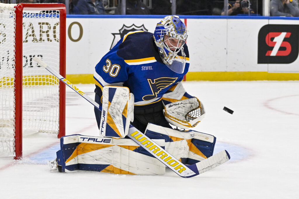 Joel Hofer of the St. Louis Blues deflects the puck with his mask News  Photo - Getty Images